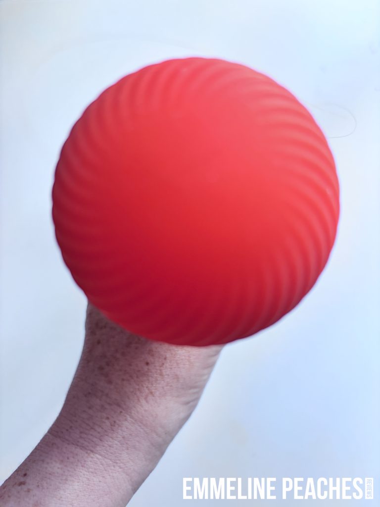 Fun Factory VIM being used as a full body massager on shoulders