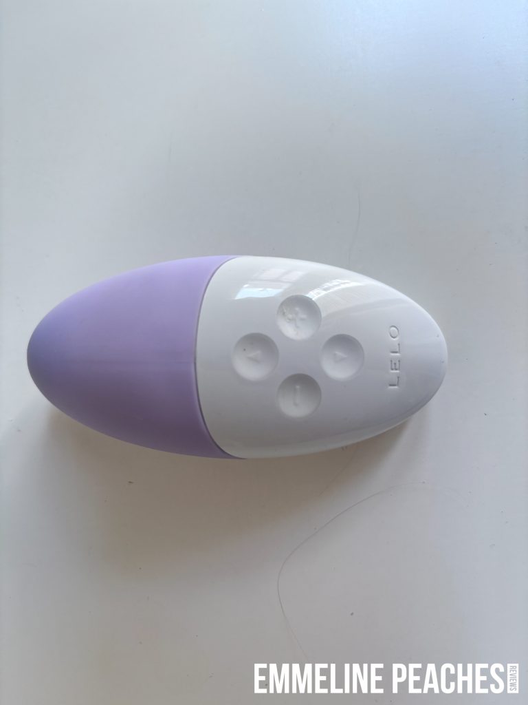 Lelo Siri 3 vibrator with its charging cable and storage pouch