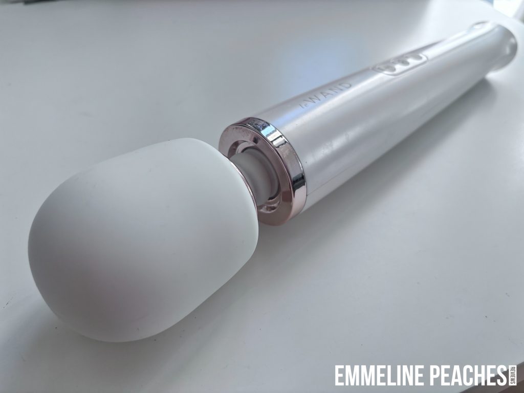 LeWand Vibrator in white with rose gold accents showing the sleek design and silicone head